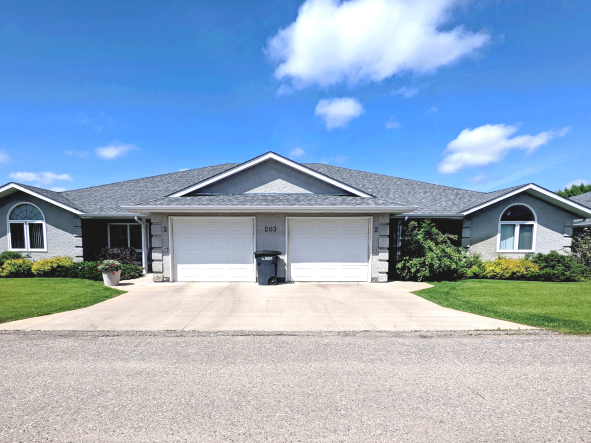 a house with a driveway and a garage door